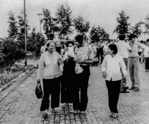 HANOI, Viet Nam, September 1974—Vo Thi Thé (left) and Tuyen welcome Arlene at airport.