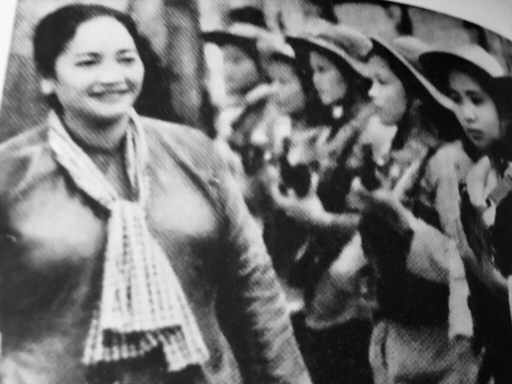 General Dinh reviewing her troops who were part of the liberation army that defeated U.S. invaders.